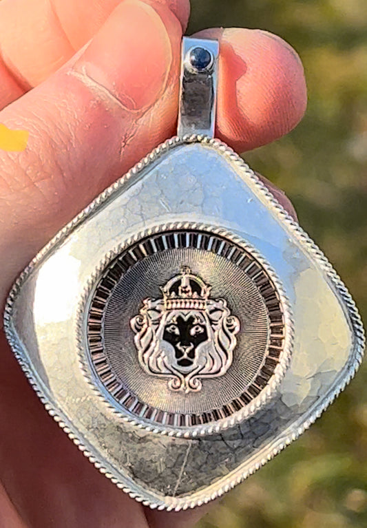 Silver lion coin pendant with hammer finish